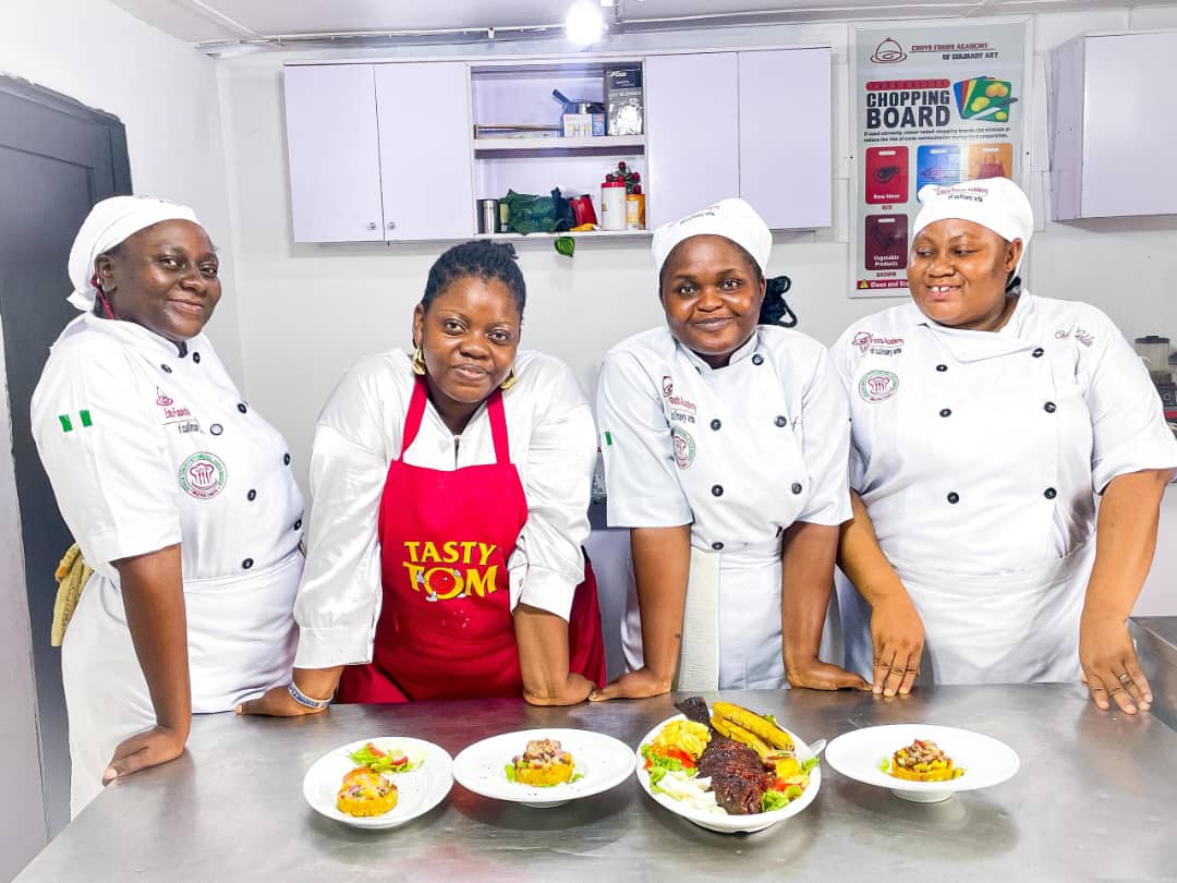 four chefs and with prepared delicacies